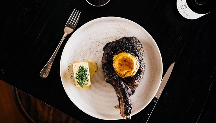 Cape Grim rib eye with cafe de Paris butter (Image Black Cow Bistro)